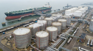 Aerial view of specialized oil terminal infrastructure including heated storage tanks and insulated pipelines for heavy crude transport.